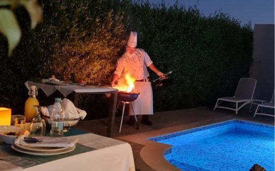 A romantic candle lit BBQ with a private chef in your villa